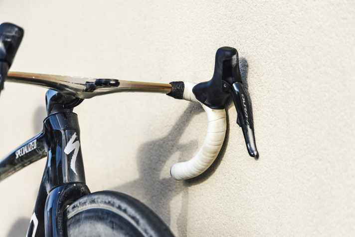 The formerly white handlebar tape no longer looks fresh