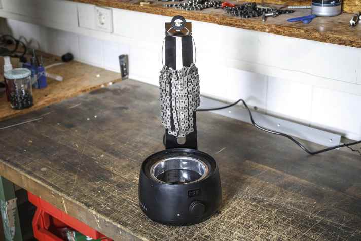 It is best to hang the chain over the pot to dry so that no wax is lost