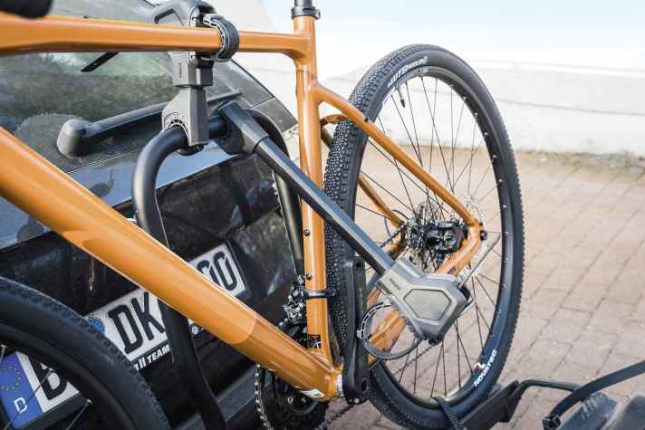 The sequence is important:  If there are two bikes on the rear carrier, the longer holding arm should be positioned when placing the first one so that its loop or gripper can find a suitable clamping point on the second bike.