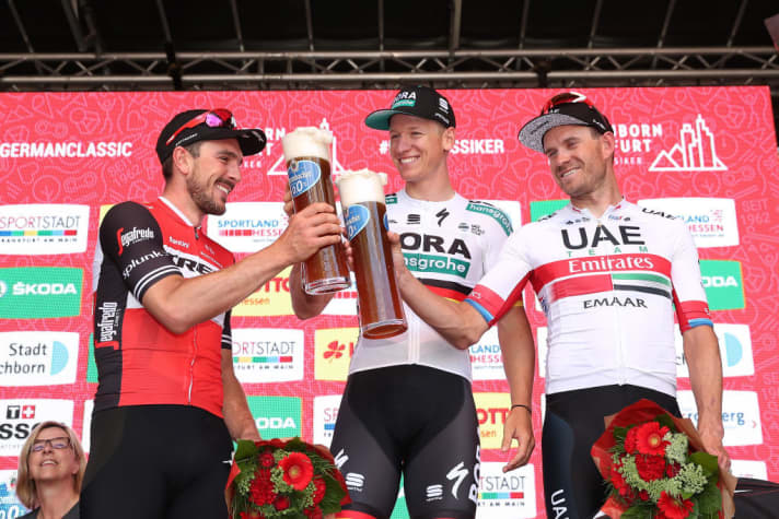   John Degenkolb, Pascal Ackermann and Alexander Kristoff savour their wheat beer after the race