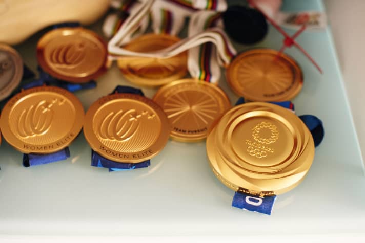 7 of Brennauer's 30 medals - including the Olympic medal (right)