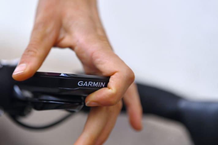 Ideally, the computer on the road bike handlebars displays performance and heart rate data.