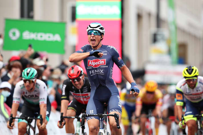  Jesper Philipsen (centre) won the race last year, leaving favourites such as Pascal Ackermann (green helmet) and John Degenkolb (red helmet) behind.