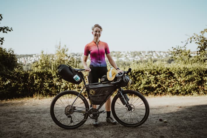 Front roll: tent, air mattress, towel and the extra set of cycling clothes.
Frame bag: repair kit, power bank, snacks, first aid kit, cooking set, cosmetics bag and small items. Food pouch on the handlebars and top tube bag: snacks
Arse rocket:  Sleeping bag, inlet, rain jacket and clothes for the evening