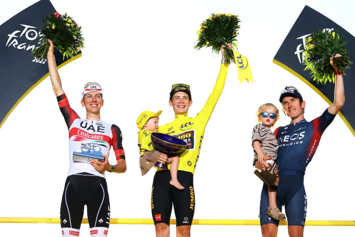 The podium of the 2022 Tour de France: Jonas Vingegaard (centre), Tadej Pogacar (left) and Geraint Thomas (right)