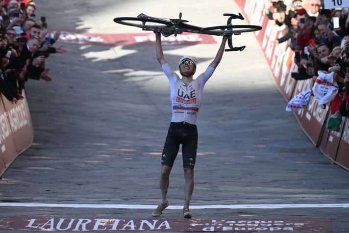 Tadej Pogacar is cheered by the fans at the finish line after a fabulous performance at the Strade Bianche
