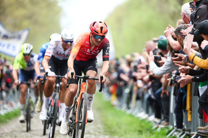 Thomas Pidcock with Nils Politt on his rear wheel in the Arenberg forest