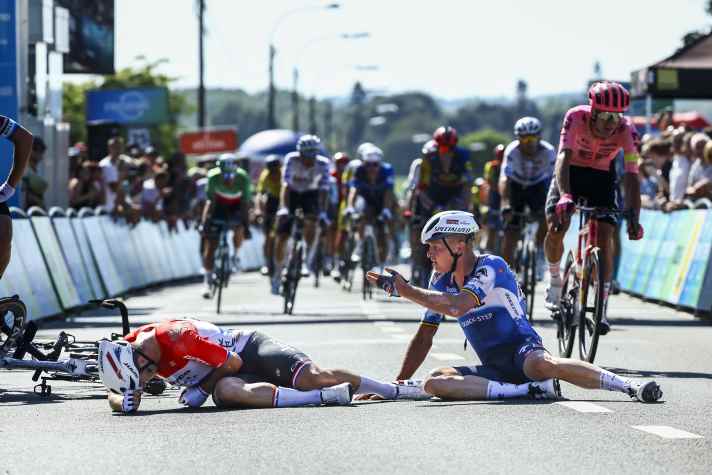 Dylan Groenewegen (left) and Tim Merlier (right) after their crash
