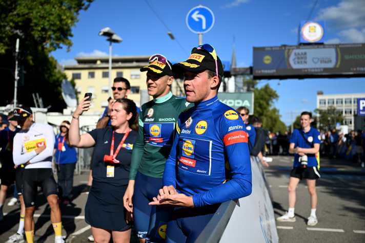SAARBRUCKEN, GERMANY - AUGUST 25: Mads Pedersen of Denmark and Team Lidl - Trek celebrates at podium as Blue Leader Jersey winner during the 39th Deutschland Tour 2024, Stage 4 a 182.7km stage from Annweiler am Trifels to Saarbrucken / #UCIWT / on August 25, 2024 in Saarbrucken, Germany.  (Photo by Christian Kaspar-Bartke/Getty Images)