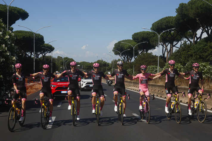 The team around Simon Yates celebrates victory in the overall classification