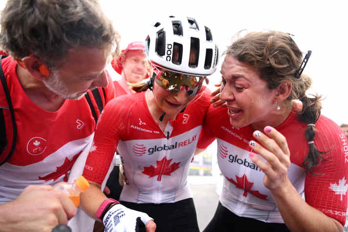 Magdeleine Vallières is welcomed as the new world champion by her national team colleague Alison Jackson after the race in Kigali