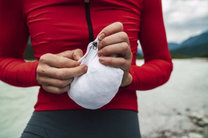 The Spinshift Windbreaker can be packed away small - in its own pocket.