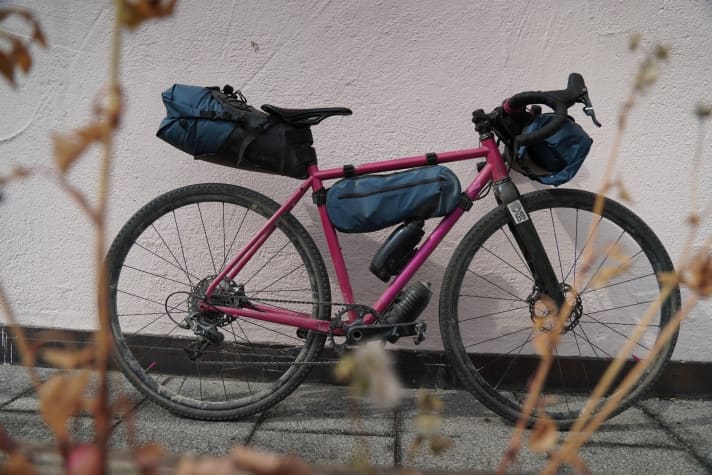 Deuter uses a two-part construction consisting of a holster and drybag for the saddle bag and handlebar roll.