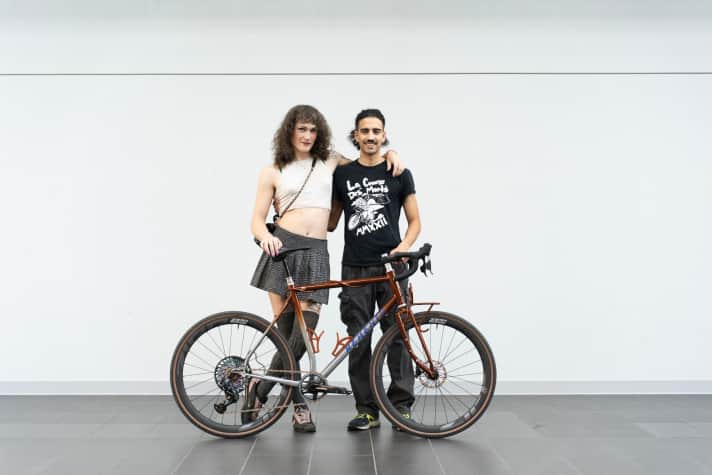 Éliane Trudeau and Ronny Perez Jaramillo with the second bike they brought to Bespoked. They were particularly impressed by the playful cable routing tube wrapped around the top tube.