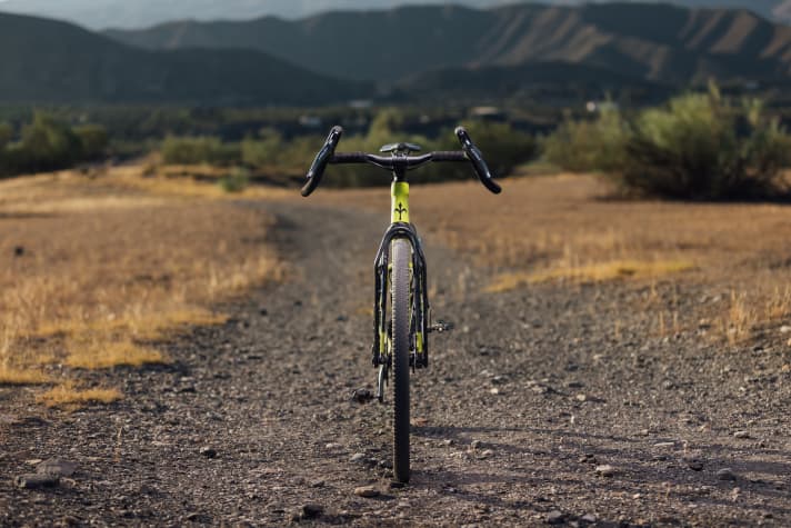 The wide and flared handlebars are designed to provide better control off-road