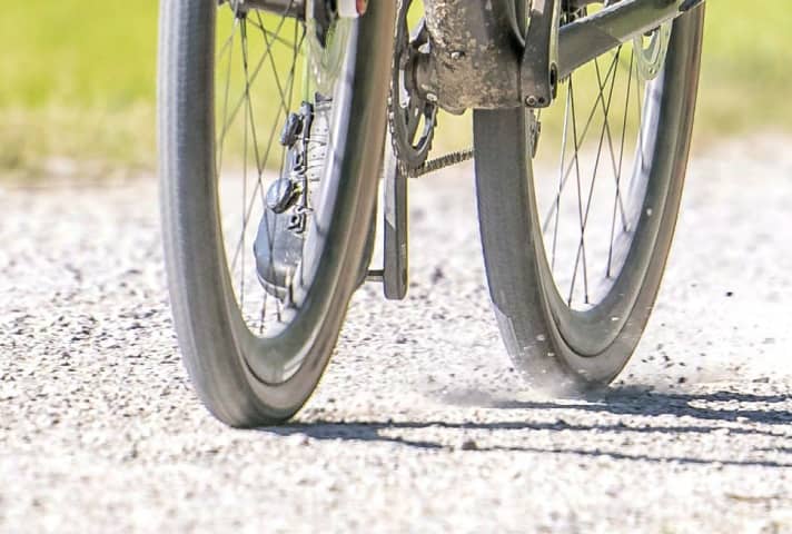 On gravel it is better to have less pressure in the tyres.