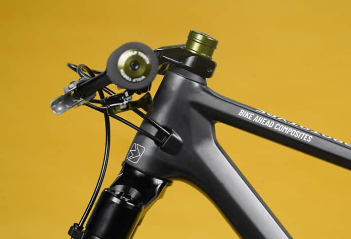 To compensate for the large front wheel, the prototype requires a special stem with an angle of -40 degrees.