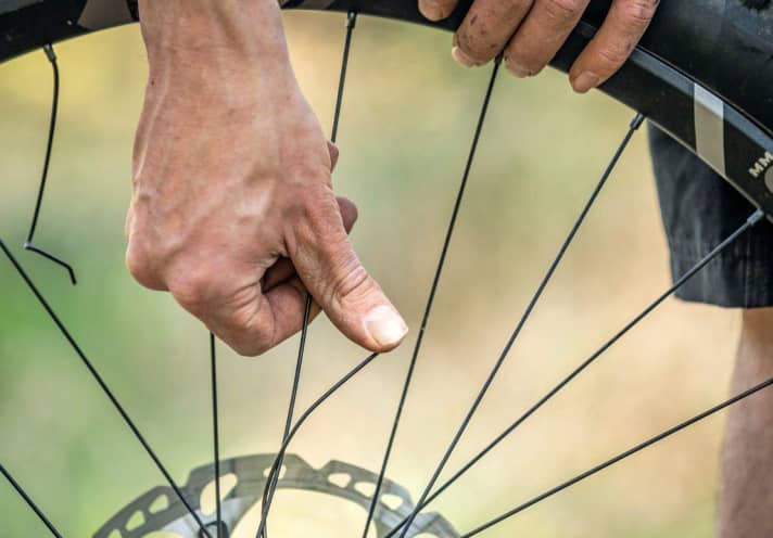 A broken spoke can be repaired in a makeshift manner.