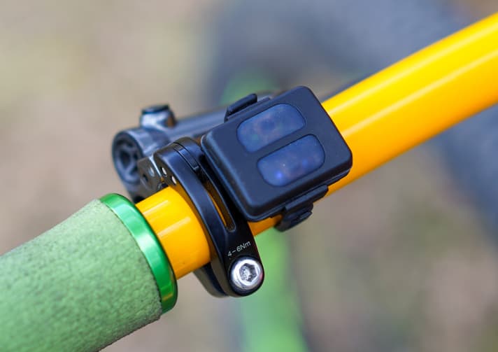   The switch communicates with the lamp head via Bluetooth. One button is used to move up the modes from level 1 to 4, the other to move down again.