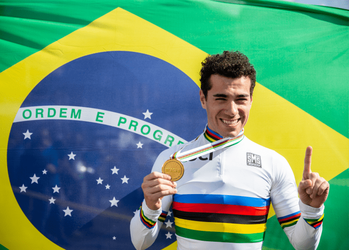 The beaming winner Henrique Avancini in the world champion jersey.