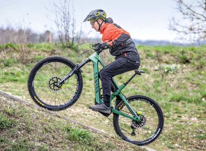 Steeply uphill with a bent-over posture.