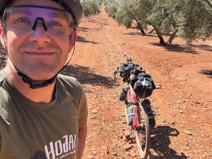 Rough red earth in the olive groves, later the finest tarmac and a tailwind all the way to Cordoba.