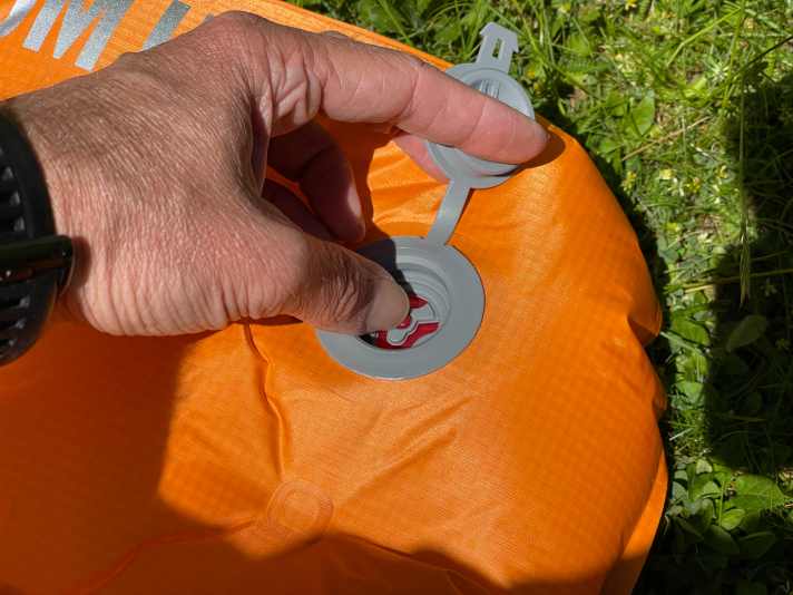 To let the air out, you have to keep the valve pressed. This makes it almost impossible to fold when you are alone.