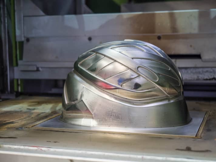   This aluminium mould slides into the top shell from below and gives it the right shape.