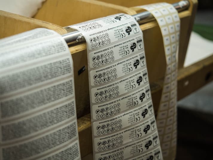   Size information and safety instructions are glued to the inside of the shell.