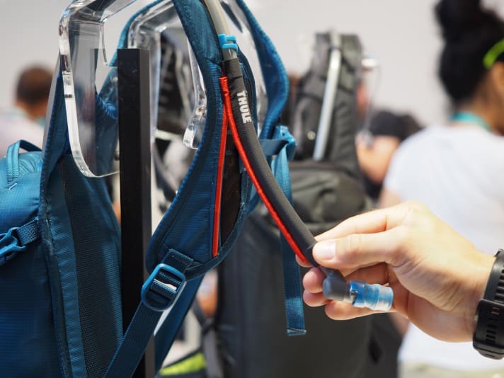   The drinking tube is held on the shoulder strap by a magnetic strip.