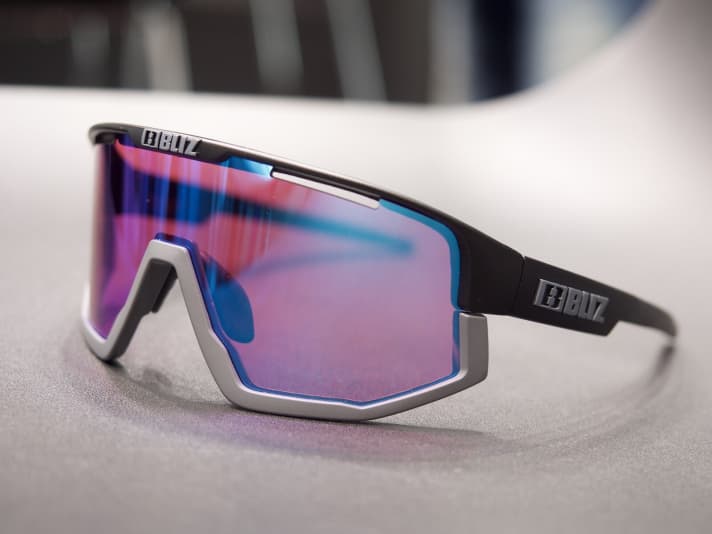   We first noticed the Fusion from Bliz at Eurobike 2019. It fits seamlessly into the queue of retro eyewear that is currently flooding the sports eyewear market.