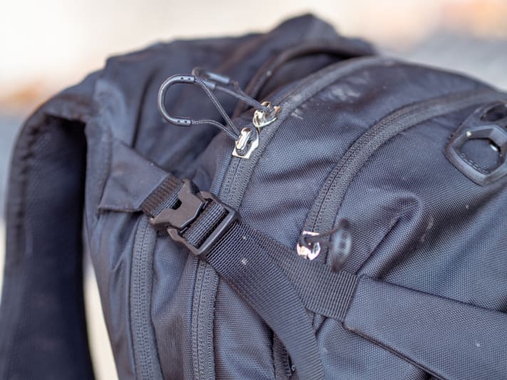 The lashing straps must be released to access the main compartment