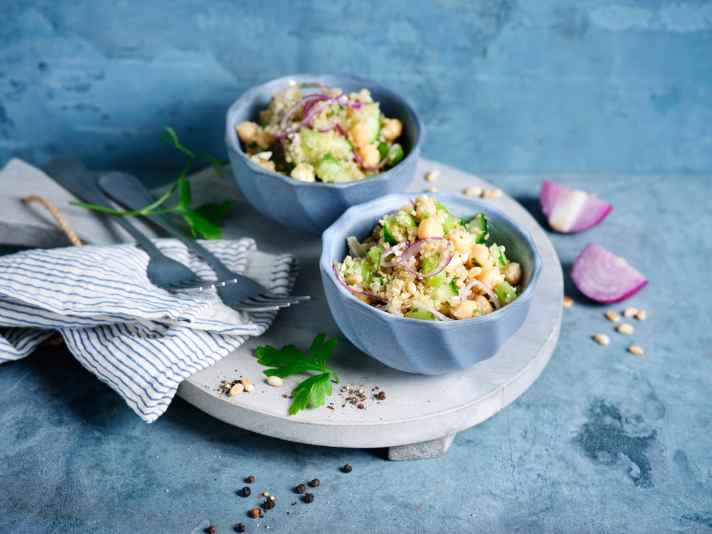 Quinoa salad harmonises perfectly with chickpeas and fresh herbs. Cucumber works well instead of tomatoes.