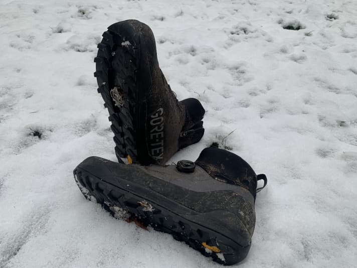 The sole is very grippy, but feels as hard as a board. You don't get that hiking boot feeling. And when you step up on the ball of your foot, the heel slips up a little.