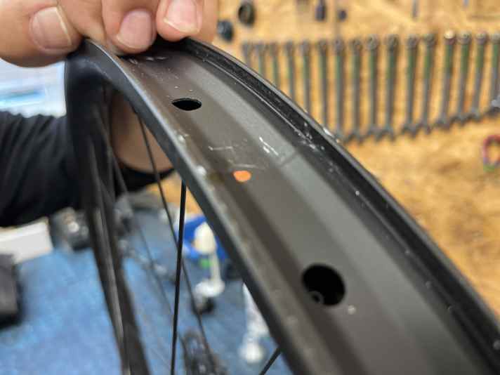 Defect at the rim joint. Two round metal pins, which ensure that the two rim ends are joined together during production, came loose and caused the "clicking" sound. Warranty claim!