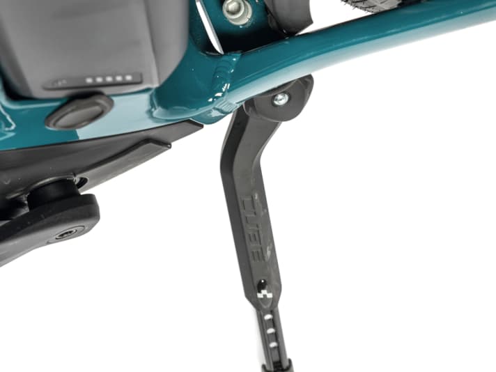 The Cube has a centre stand. However, when loaded, the bike would be more stable with a rear kickstand.