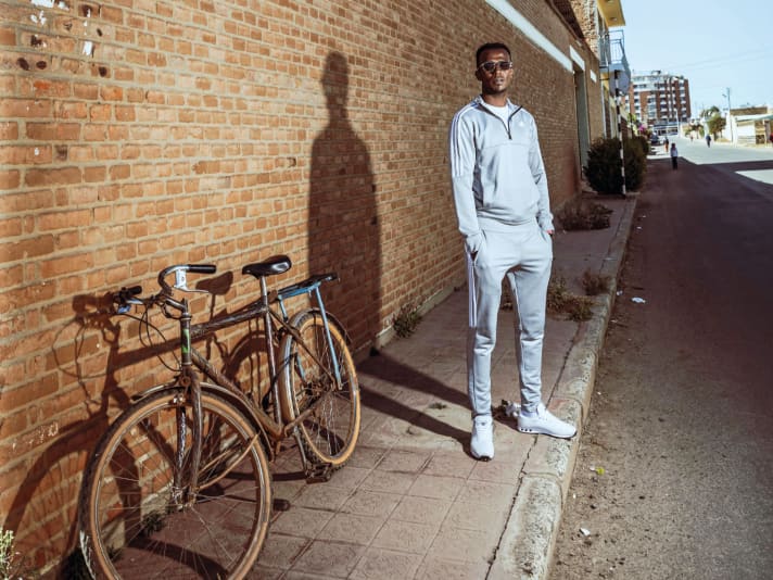 Biniam Girmay prefers to take photos in quiet side streets - he doesn't want to cause a crowd.
cause a crowd