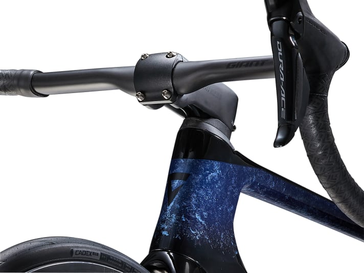 The cables are routed through the handlebars and under the stem into the frame.
