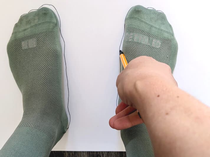 A outline drawing helps you measure your feet.