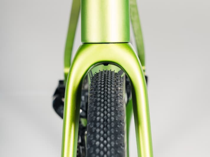 The 35-millimetre Continental tyres arch 38 millimetres over the carbon rims.