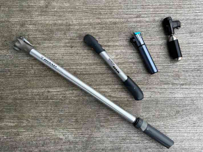 Pump stations of a racing bike's life: frame pump, mini pump, mini mini pump and CO2 cartridge