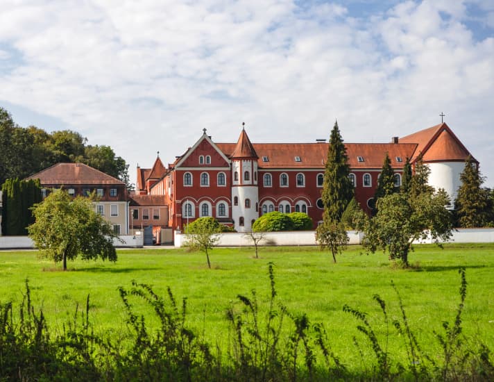 Magnificent red building: St Gertrud Monastery in Tettenweis