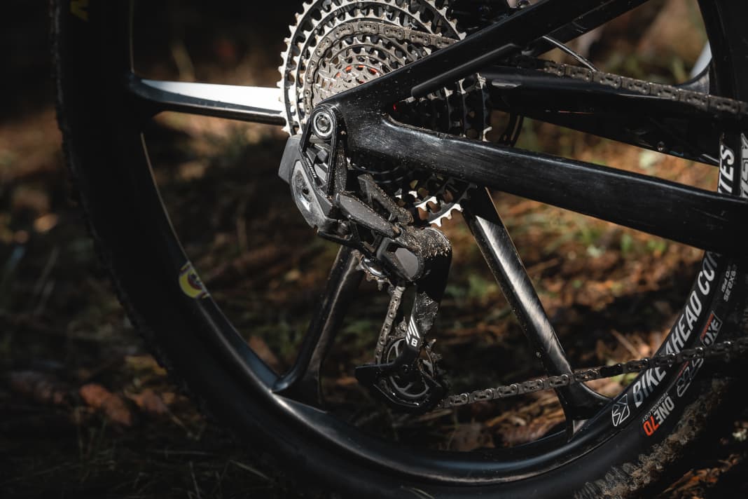 The rear derailleur is clamped directly to the rear wheel axle.