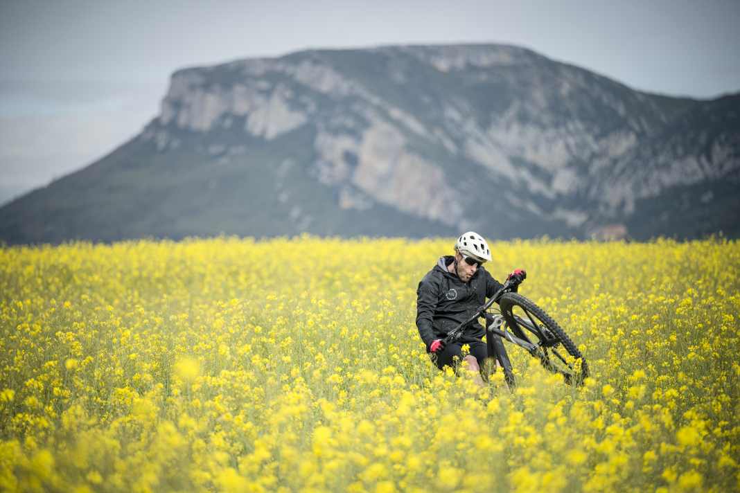 Spring at last! Wheelie in the rape: bike adventurer David Cachon.