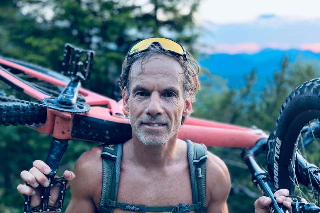 Deuter Trans Alpine in action. The pack is designed to make carrying your bike more comfortable. Forgive me for the topless photo, but it gets hot on the climbs!