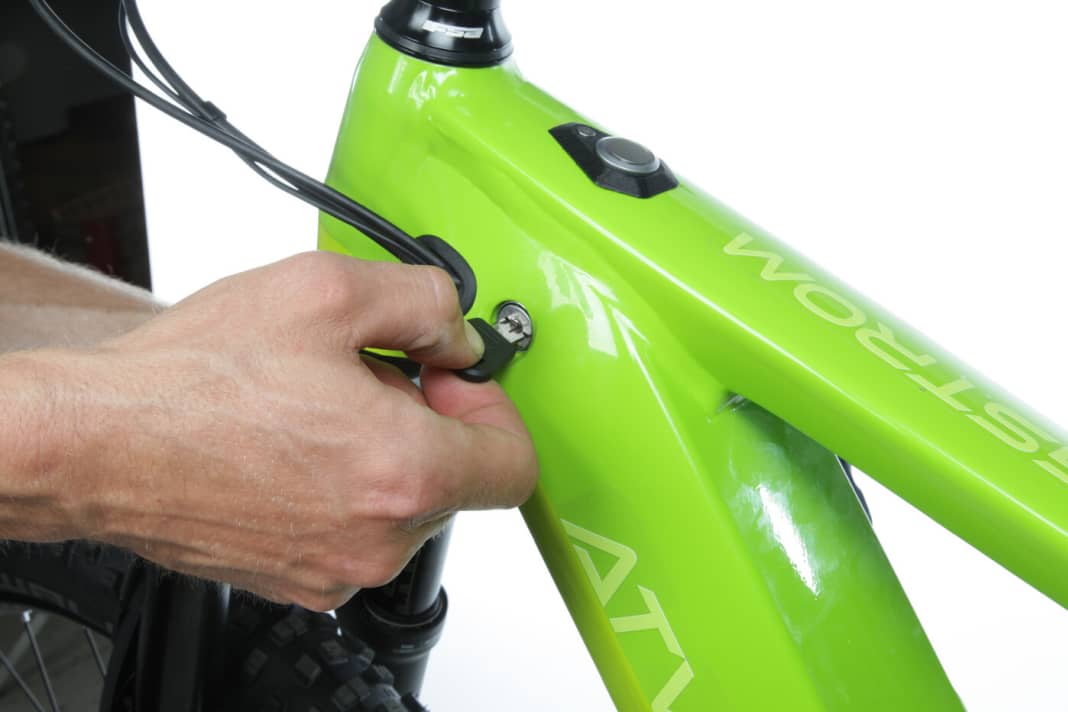 The battery is secured with a lock.