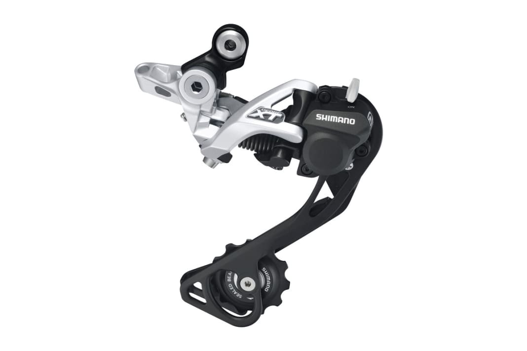 Shadow Plus heißt das schwingungsgedämpfte Schaltwerk bei Shimano – per Hebel abschaltbar und von Deore bis XTR erhältlich. Bei der Shimano XTR sogar justierbar.