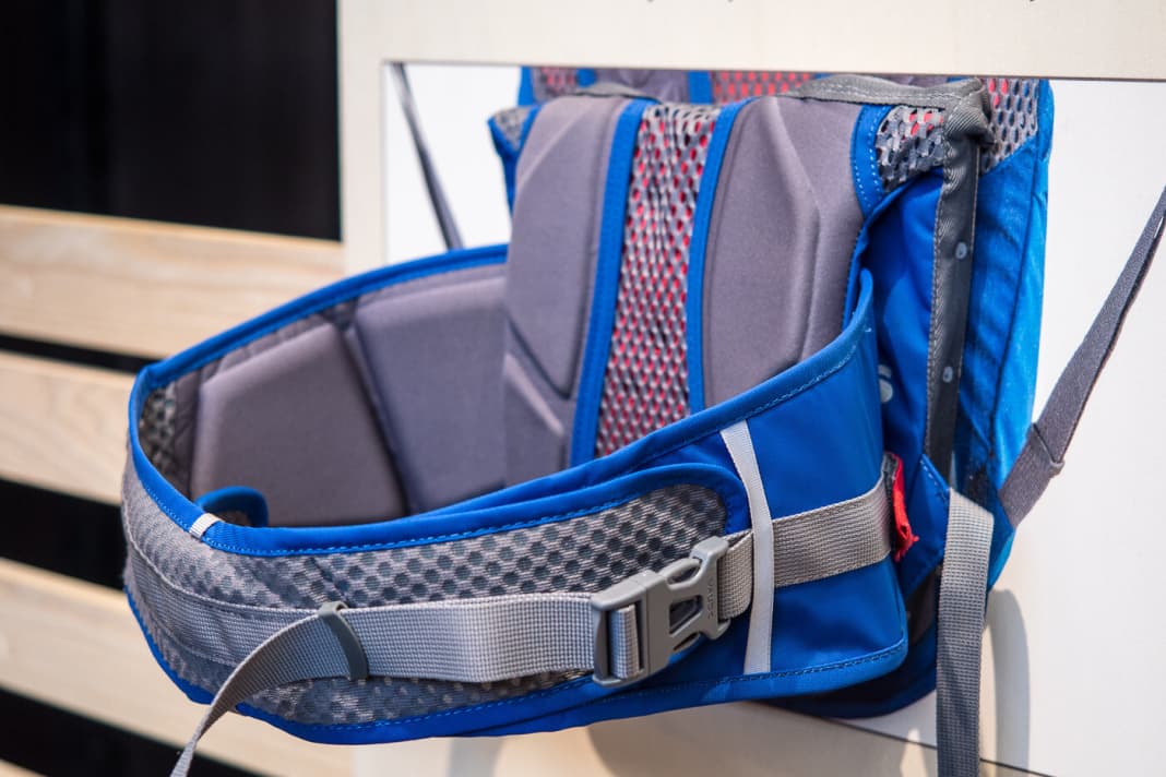 The circumferential hip belt is designed to attach to the carrier like a spider monkey.