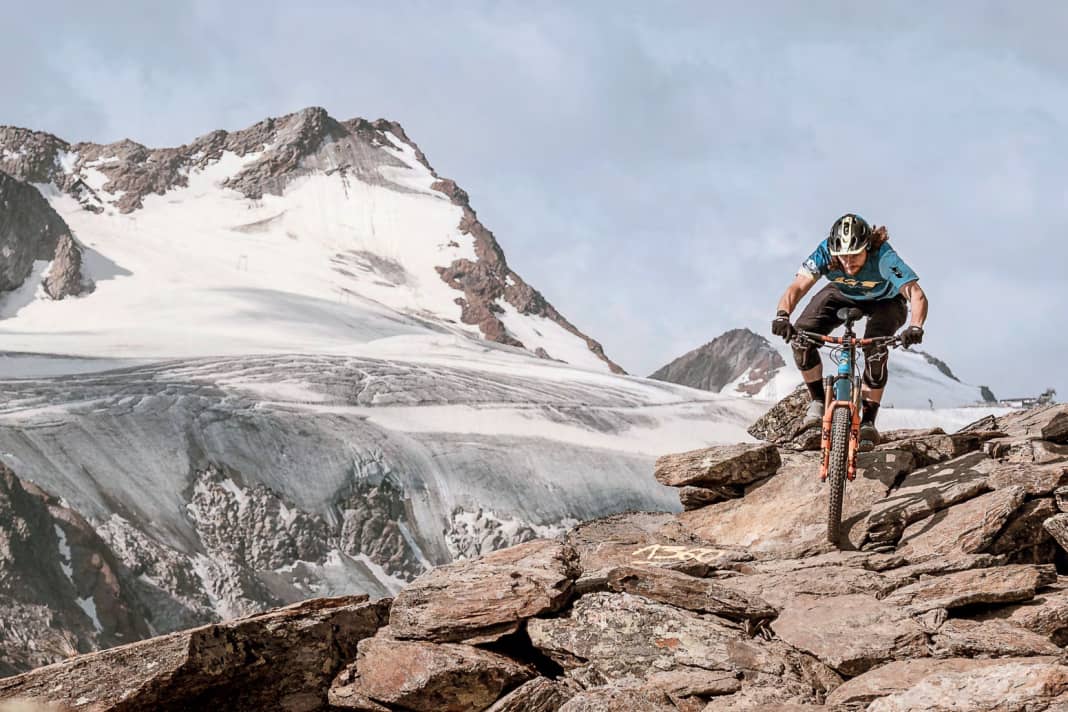 Biking away from the park trails. Here, bike celebrity Wyn Masters steers his enduro bike over slate slabs on the Long Trail Ferner in Sölden.