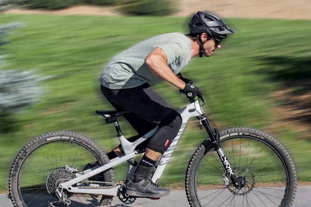 Build up tension. To do this, bend low over the bike.